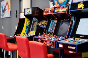 Back to the arcade days! Our game room is ready for you to add your initials to the score boards!