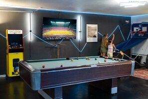 Game time meets chill time in this all-ages game room with plenty of space to play and relax!