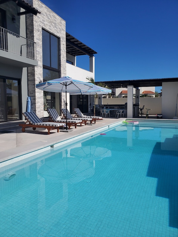 Private pool with fountain and lights