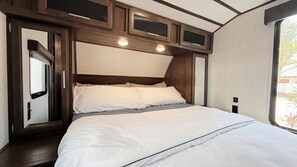 Private master bedroom features a queen-sized bed, separate closets, Usb Ports.
