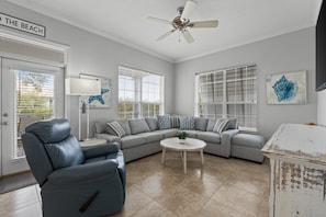 Bright and welcoming living room with ample seating—perfect for movie nights or morning coffee.