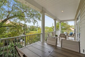 Unwind on the spacious balcony surrounded by lush greenery—ideal for peaceful mornings or evening chats.