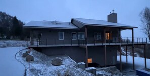 Decks galore.  Side deck is covered with an outdoor fireplace.