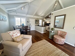 Additional seating, mirror, dining area, front door, kitchen
