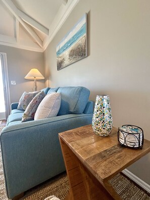 Queen-size sleeper sofa with memory foam mattress, end table