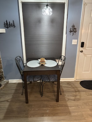 Table for 2 or fold out the hidden leaf for 4! 2 more chairs are in the condo.