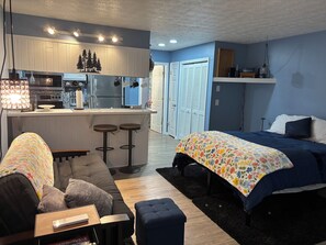 One room with dining/living/sleeping. Queen Bed, Futon and Bar Seating.