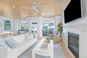 Living room with flat screen TV and fireplace
