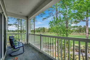 Kick back with your morning coffee or an evening drink—this private balcony overlooks the gorgeous fairways of the World Tour Golf Links.