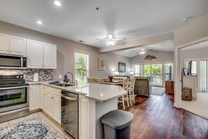 Open-concept kitchen, dining, and living space—perfect for gathering, relaxing, and making memories.