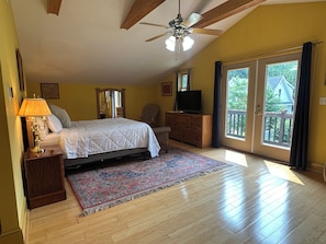The upstairs primary suite includes a queen bed and private bath with a deep soaking tub—your own peaceful hideaway.