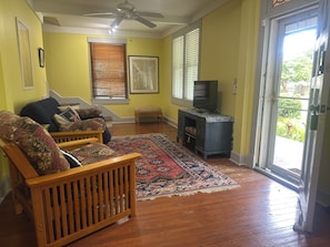 Read, Relax, or Rock Out: A futon, armchair, Smart TV—and even a drum set—make this space as fun as it is functional.