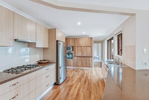 Challenge your inner cook in the well-equipped kitchen, complete with gas cooking, a dishwasher, and everything needed for casual meals or family feasts.