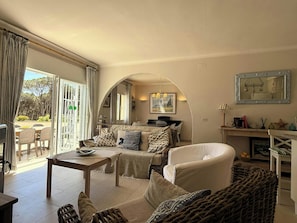 If you're craving some downtime indoors, our living room is the perfect spot to unwind. There are several chairs and a sofa, so there's plenty of room for everyone! There's a TV and a stereo for listening to music, so you can relax and unwind.