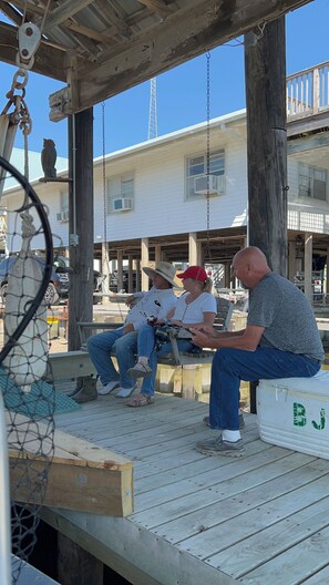 Big porch swing st the boat dock.