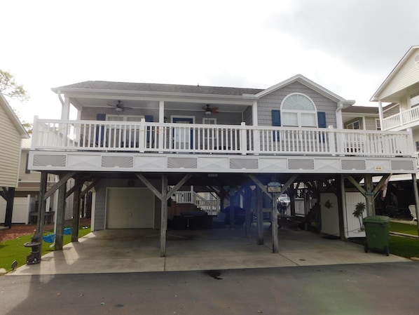 8038 3/2 on stilts with plenty of parking and swings/hammock under home