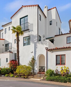 Charming exterior of condo, showcasing multi-levels