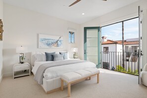 Upstairs primary bedroom with king bed and french patio doors is the perfect escape
