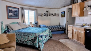 Studio-1 queen bed, 2 twin beds, 2 twin floor mattresses, love seat, kitchenette
