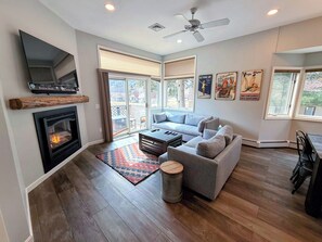 A gas fireplace awaits to warm you on chilly days.