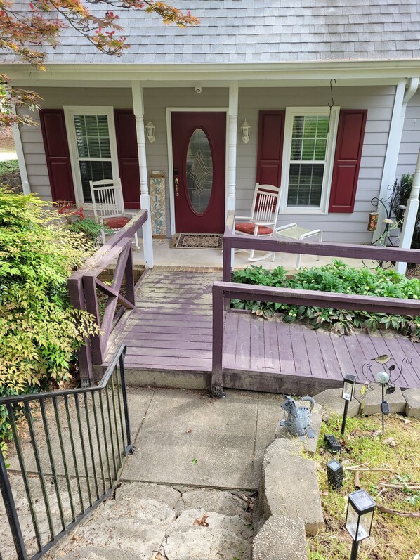 Relaxing front porch with rocking chairs, handicapped friendly with ramp access 