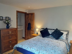 Ground floor double bedroom with en suite toilet and basin