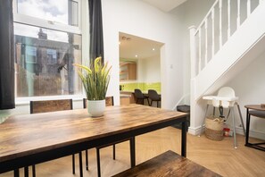 Dining area within the living area, with seating for up to 4 people — perfect for a night in with a home-cooked meal.
