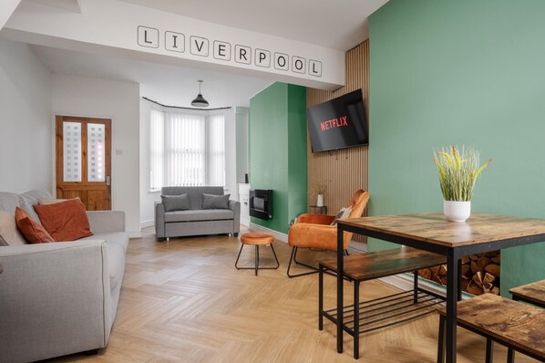Comfortable Living Space featuring:
- Smart TV with Netflix
- 1 x Sofa Bed
- 1x  Chair and Ottoman Set