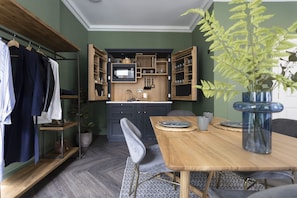 Studio with bed and kitchen