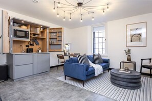 Studio with bed and kitchen