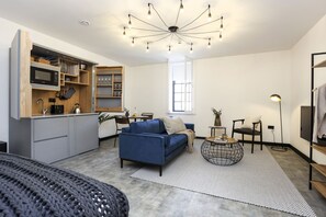 Studio with bed and kitchen