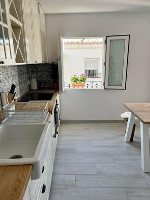 Open plan new Ikea kitchen with appliances