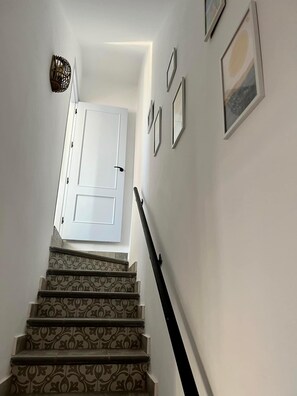 pretty stairs leading up to the open plan kkitchen diner!