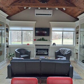 Vaulted Ceiling, bookshelves and glass cabinets on either side.