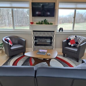Electric Fireplace, TV, Picture Windows to fields and island.