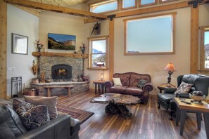 Living room with wood-burning fireplace and Smart TV