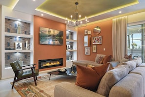 Cozy modern living room with fireplace, chic decor, and charm!