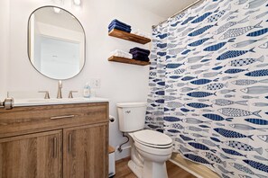 Wash up in the full bath, featuring a single vanity & shower/tub combo