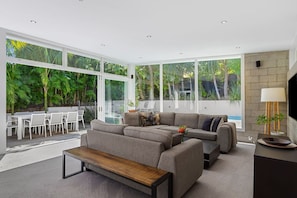 Stunning open plan living leading to private tropical courtyard and pool area