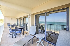 Balcony with dining tables and chaise lounges