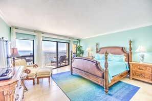 Primary bedroom - Primary bedroom with king bed, TV and sliding door to oceanfront balcony