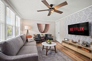 Bond with your loved ones in this charming and well-decorated family room