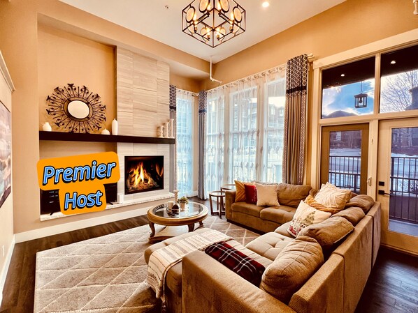 Spacious living room with soaring ceilings. Cozy gas fireplace and smart TV.