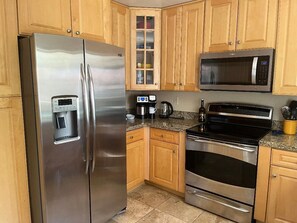 Full size refrigerator, stove, oven, microwave, dishwasher and coffee maker