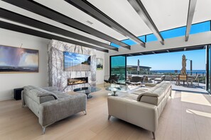 Living Room with Sliding Doors that Open to the First Floor Patio