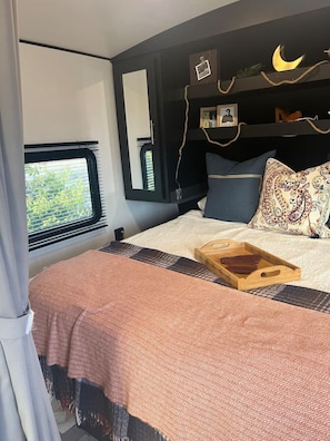 Queen Sized Bed with plenty of storage and Linens