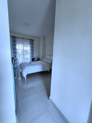 Double bed with comfy thick mattress and crisp white linnen