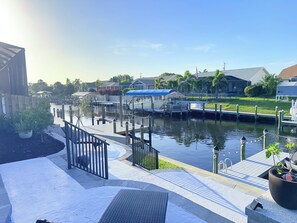 View of canal from tiki. Catch the sunset or a few fish from the dock!