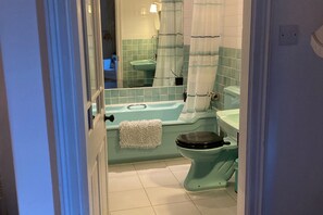 Large ArtDeco bathroom. Heated towel rail. Edwardian stained glass windows. Bath and shower over.