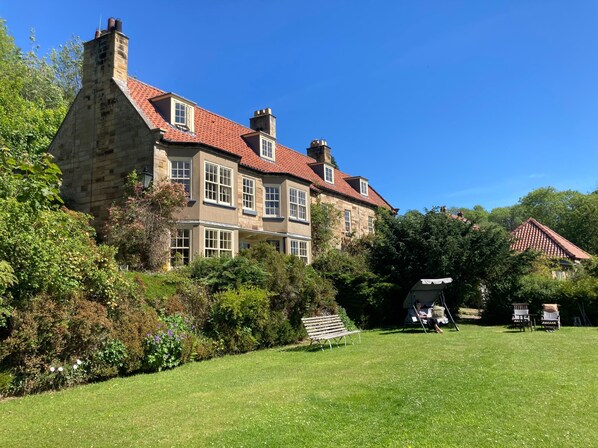 Groves Hall Grade II Listed Georgian stone built property with large mature gardens overlooking the Esk Valley. South facing and perfect place for sunbathing and relaxing.